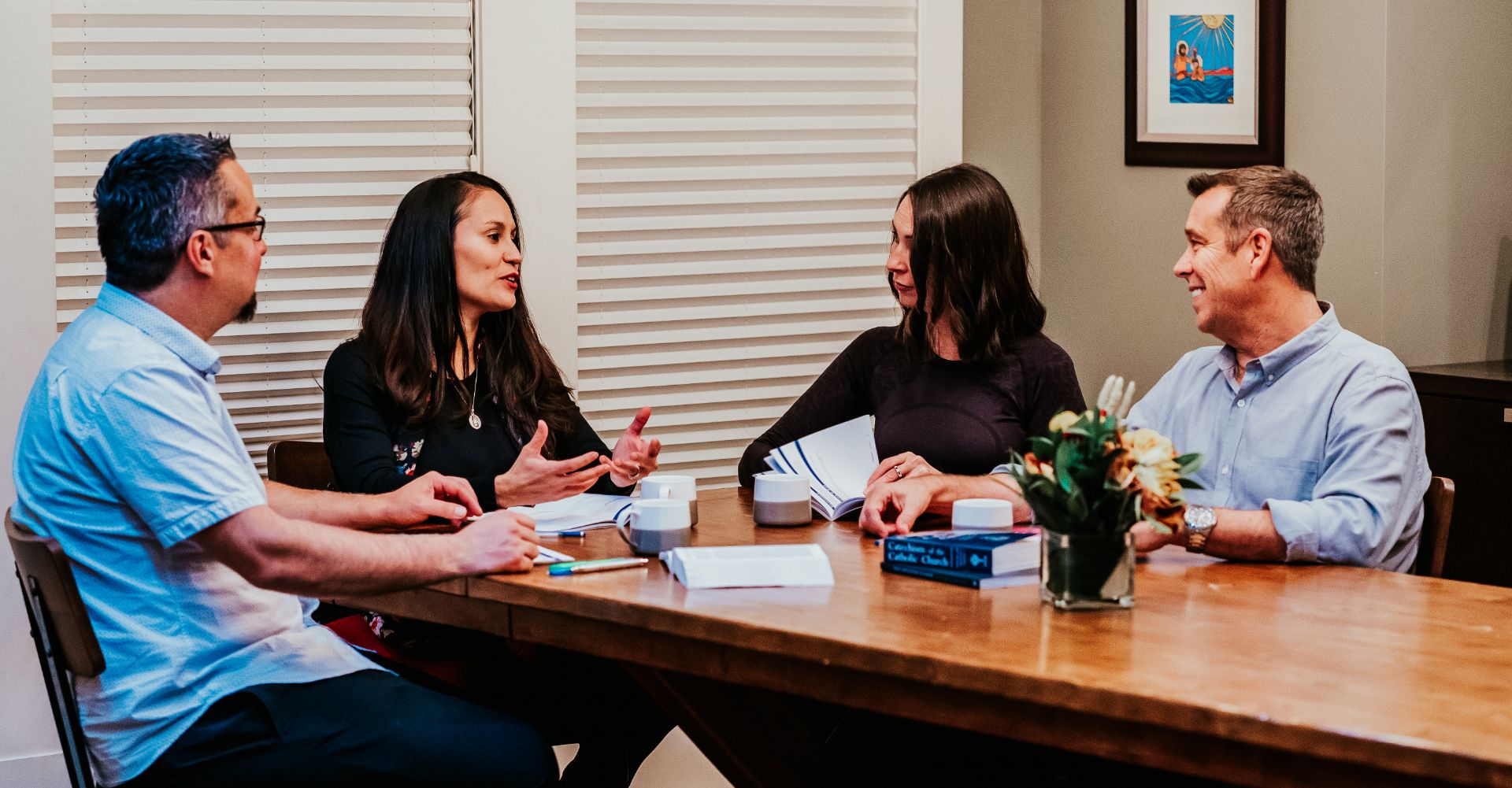 Four parish leaders meeting around a table